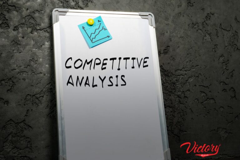 a white board with a word "Competitive Analysis" and a drawing of a chart above.