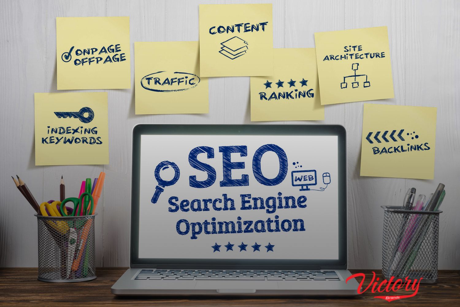 a laptop with a word "SEO Search Engine Optimization" on screen. With a lot of sticky notes in the background