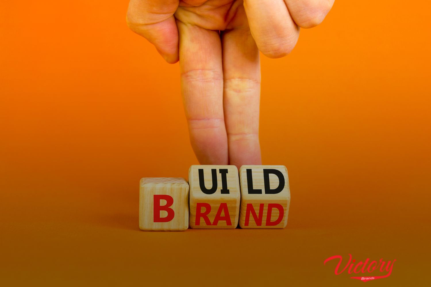 a wood pieces with a word "Build Brand"